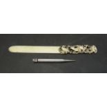 A carved bone page turner with carved stag and rabbit handle and a silver propelling pencil (2)