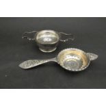 An A Chick & Sons Ltd silver tea strainer,
