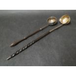 Two Georgian ladles with gold coins attached to bottom,