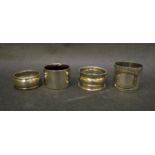 Four silver napkin rings, various dates,