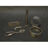 Various silver items including two napkin rings, money clip, "D" keyring, golf bag stick pin,