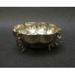 A silver petal form bowl on four scroll feet, London 1903,