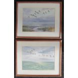 ROLAND GREEN (1896-1972): Two oak framed and glazed watercolours, geese taking flight. Signed.