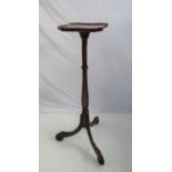 A 17th Century revival mahogany candle stand the dished top with pinched corners on shaped column