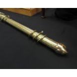 A brass engraved decorated curtain pole with rings,