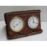 An Asprey, London travelling clock/aneroid barometer in crocodile skin case,