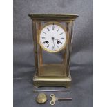 A 19th Century French four glass mantel clock in brass case (back panel loose),