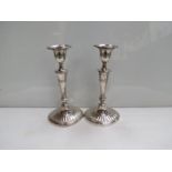 A pair of William Hutton and Sons Victorian silver candlesticks of fluted oval section.