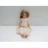 A 21" German bisque headed doll, in white dress and shoes, marked "C4" to back of head,