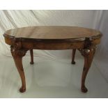 A George II style burr walnut occasional table the shaped oval top over acanthus leaf carved and