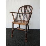 A circa 1820 elm & ash Windsor stick back elbow chair the central splat having pierced decoration