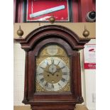 A Georgian oak longcase clock with arched brass dial and silvered Roman chapter ring, signed,