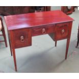 A George III crossbanded mahogany side table with three drawers over square tapering leg supports
