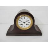 An oak Napoleon hat form mantel clock with Roman enamelled dial, gilded bezel,