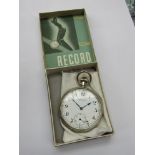 A Record base metal open faced pocket watch with Arabic enamelled dial and subsidiary seconds dial,