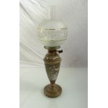 A Victorian oil lamp with drop-in font in glass with detailed meadow flowers and butterfly in white