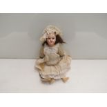 An Armand Marseille bisque head girl doll, 11",