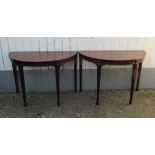 A pair of George III revival cross banded flamed mahogany demi lune pier tables,