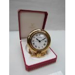 CARTIER: A gilded travel clock with alarm, boxed,