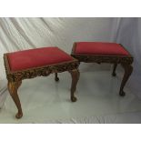 A pair of gilt stools on cabriole legs