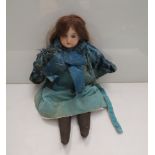 A 20" bisque headed doll in blue dress with sleepy eyes,