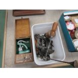 A tub of clock/watchmaker's tools including a mainspring winder and a cased jewelling set