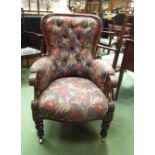A circa 1840 mahogany spoon back library armchair with carved foliate decoration the reeded scroll