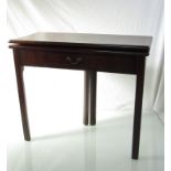 An early George III mahogany tea table, the hinged top and single frieze drawer,