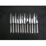 Twelve silver handled fruit knives,