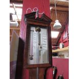 A mahogany stick barometer with broken pediment top,