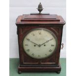 A Regency mahogany bracket clock with brass acorn finial, bezel, inlay, pierced side frets,