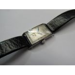 A 1930's steel rectangular cased gent's wristwatch with conex silvered dial signed Omega,