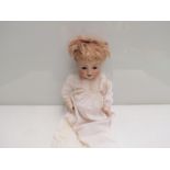A Simon & Halbig 126 Germany bisque head girl doll for re-stringing