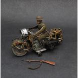A German 'Arnold' tin plate wind up WWII motorcyclist with rifle