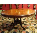 A mid Victorian walnut oval top loo table with marquetry top,