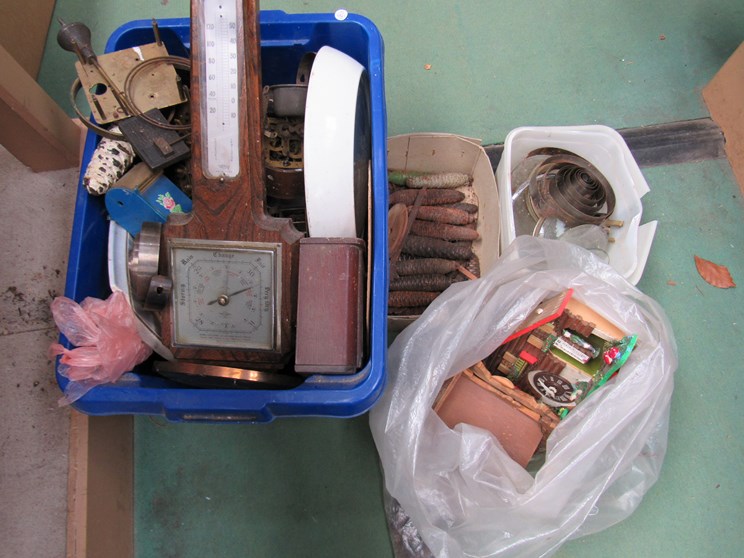 A box of mixed clock spares and parts including cuckoo