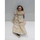 A 19th Century 24" wax head and shoulder doll with blue leather fore arms,