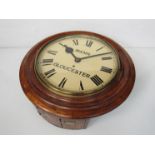 An oak station dial clock, Roman painted metal dial signed Mann, Gloucester, chain fusee movement,