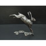 A limited edition bronze running hare 126/350,