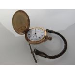 A gold plated Waltham hunter pocket watch (bezel loose,