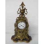 An early 20th Century brass cased French mantel clock with Roman enamelled dial (hairlined) bell