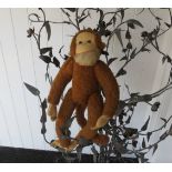 A stuffed monkey toy with moveable joints