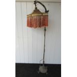 A late 19th Century standard lamp with arched top,