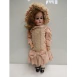 A Simon & Halbig Kammer & Reinhardt 28" German dressed doll with bisque head with open mouth and
