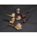 Seven Meerschaum pipes, six with mouth pieces,