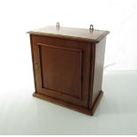 A Victorian mahogany wall hanging apothecary cupboard of small proportions with single door