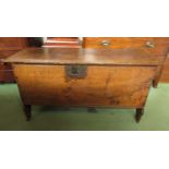A circa 1700 oak six plank coffer the hinged lid with iron clasp and key over shaped and reeded