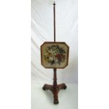 A Victorian rosewood pole screen with Berlin wool and beadwork floral panel