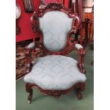 A late 19th Century continental mahogany armchair, scrolled design,