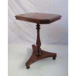 A late George III oak wine table the canted corner tilt top on baluster turned column and tri-form